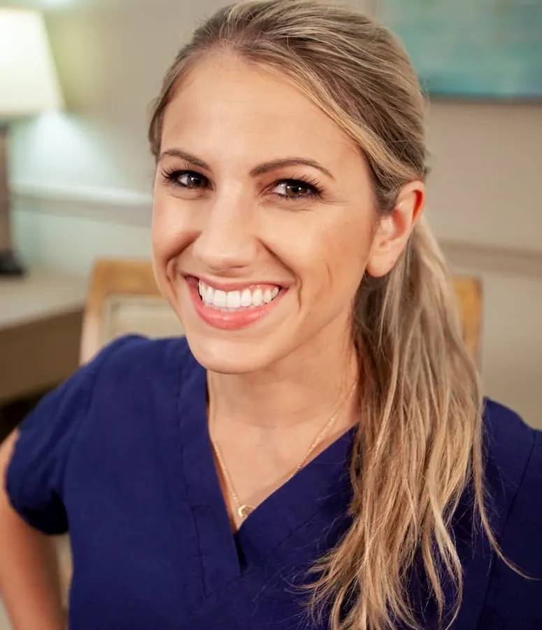 A smiling member of the Farnham Dentistry team in the office.